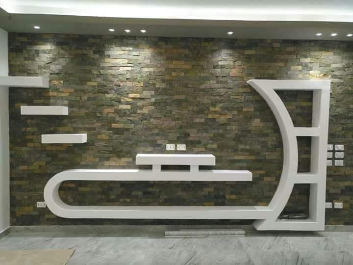 Stacked tahajjart stone accent wall with bespoke furniture, DTAT project